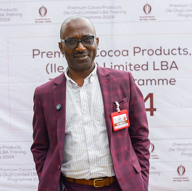 Man in business suit at Oluji Cocoa event